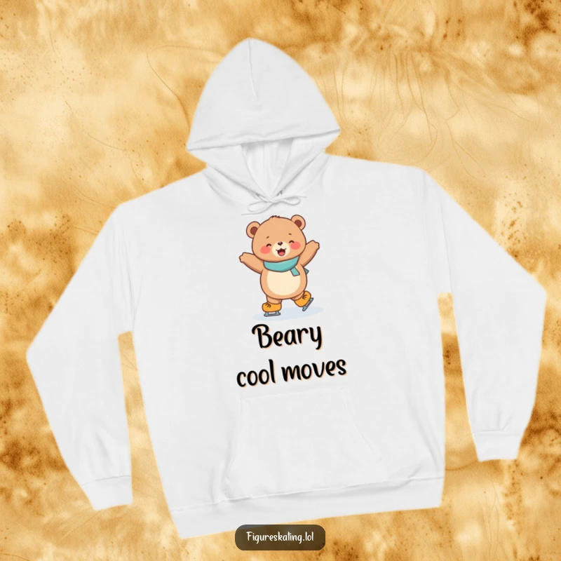 Funny hoodie with a joyful, round bear cub performing a dazzling spin on ice skates, radiating winter cheer.