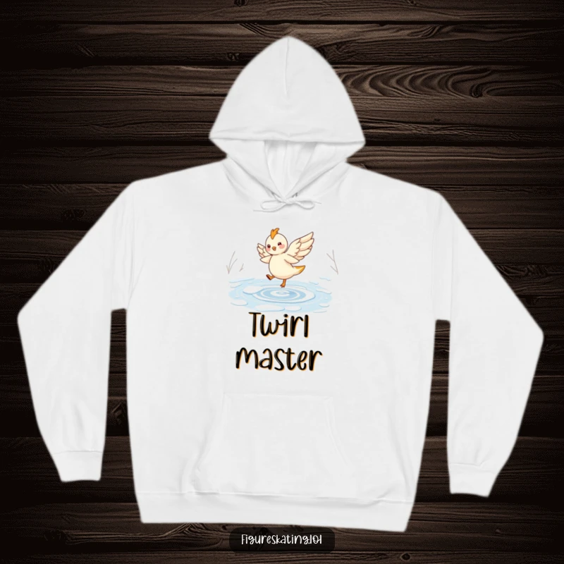 Funny hoodie featuring a cheerful, winged creature elegantly twirling on a frozen pond, perfect for cozy enchantment.